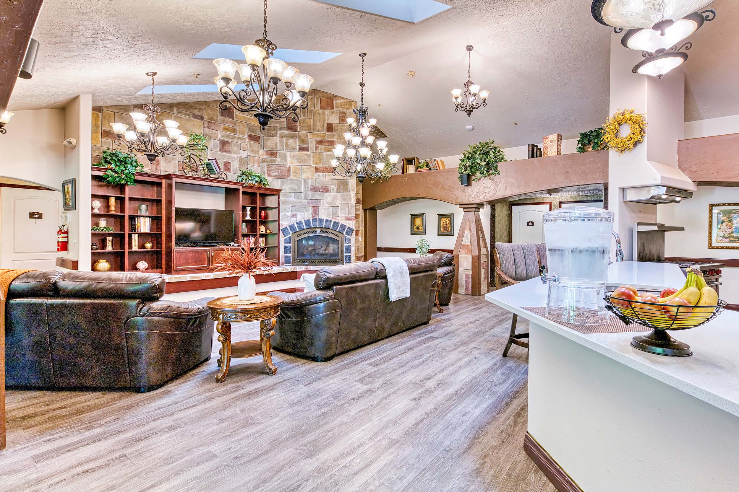 common area with seating and high ceilings with chandeliers