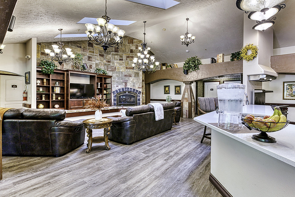 common area with seating and high ceilings with chandeliers